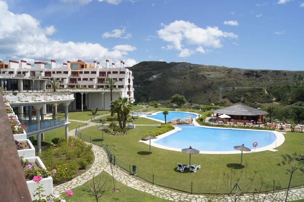 an aerial view of a resort with a pool at Apartamentos Parque Botanico in Estepona