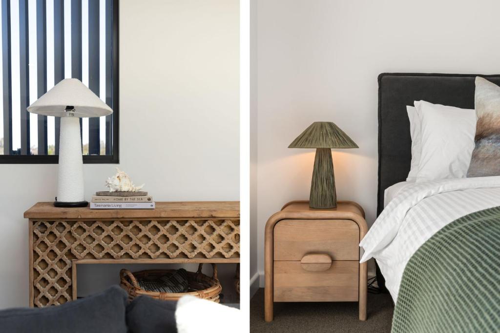 a bedroom with a bed and a fireplace at Oceanview Penthouse by Experience Jervis Bay in Huskisson