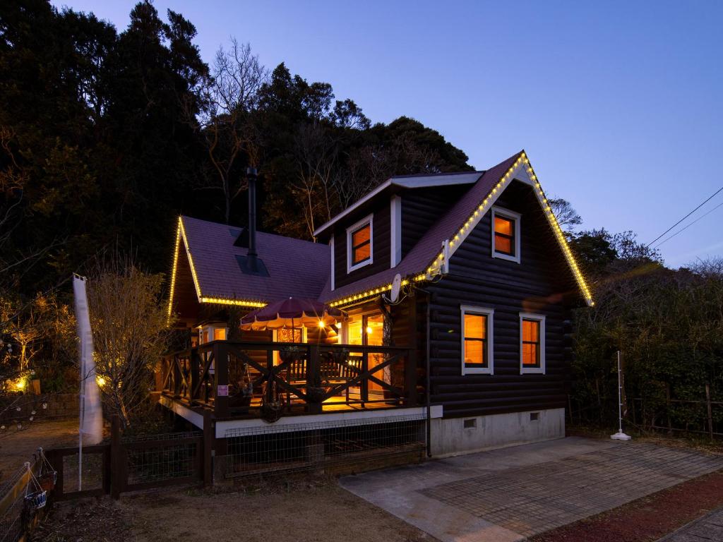 a small house with a large deck at night at ALL SEASON RESORT No2 Torino Saezuri in Chōjamachi