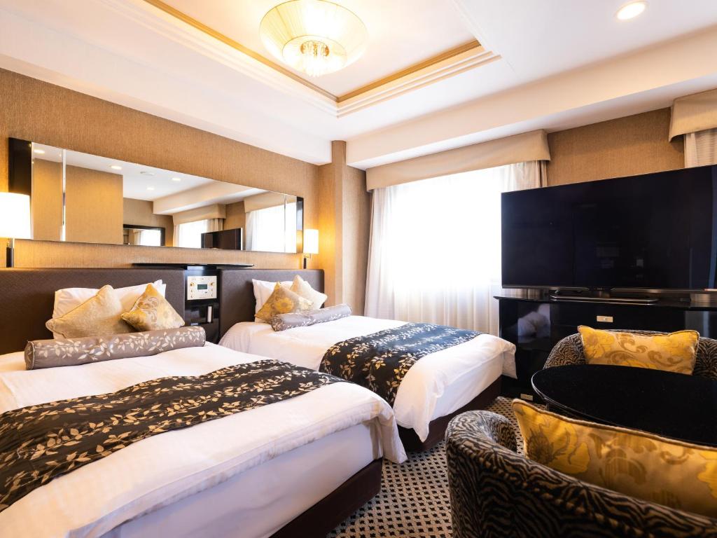 Postel nebo postele na pokoji v ubytování APA Hotel Ginza Shintomicho Ekimae Kita