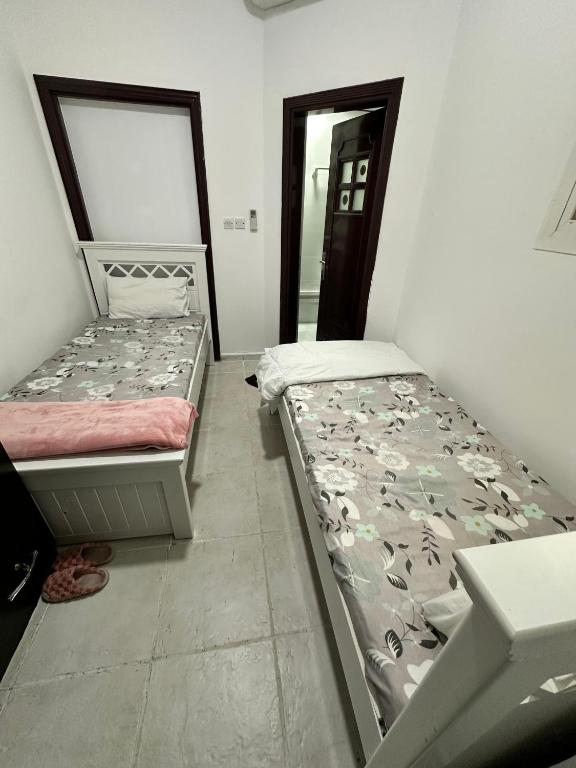 Postel nebo postele na pokoji v ubytování International Abu-Dhabi Hostel Villa