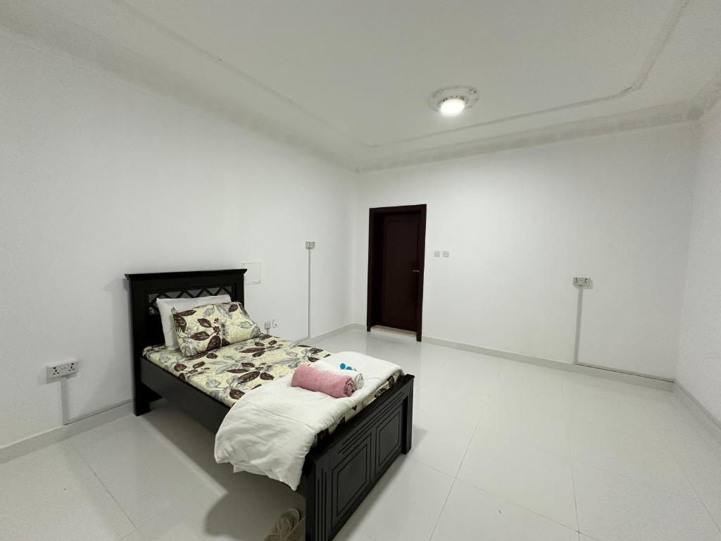 Postel nebo postele na pokoji v ubytování International Abu-Dhabi Hostel Villa