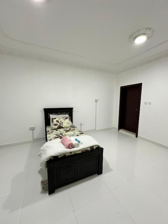 Postel nebo postele na pokoji v ubytování International Abu-Dhabi Hostel Villa