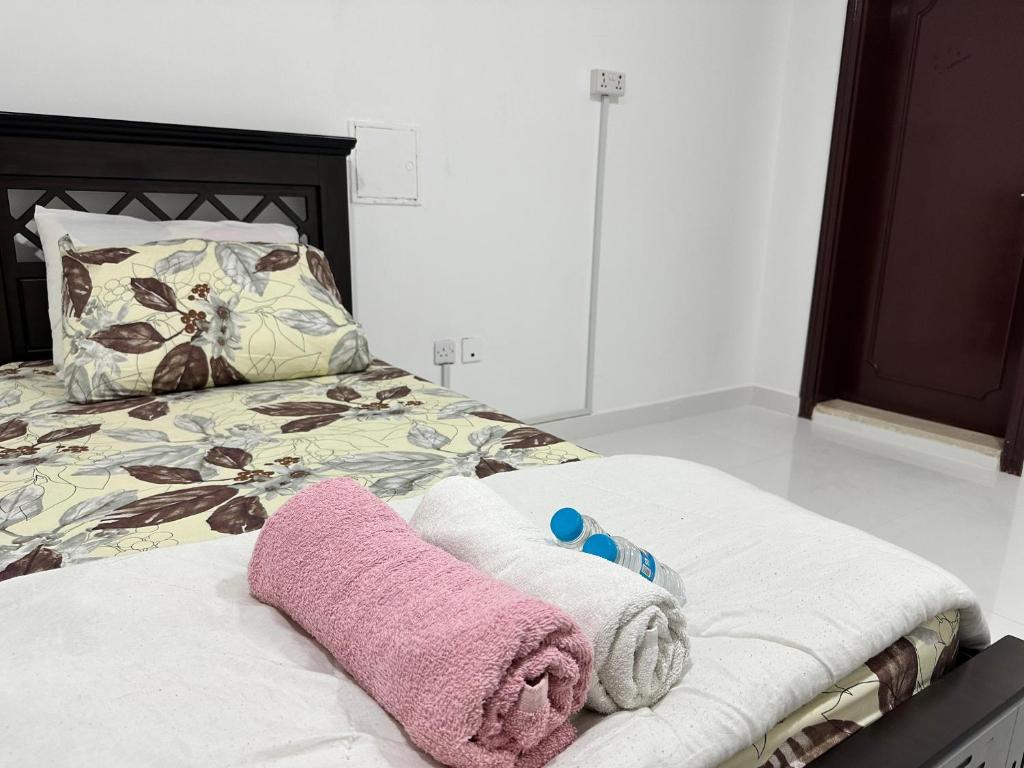 Postel nebo postele na pokoji v ubytování International Abu-Dhabi Hostel Villa
