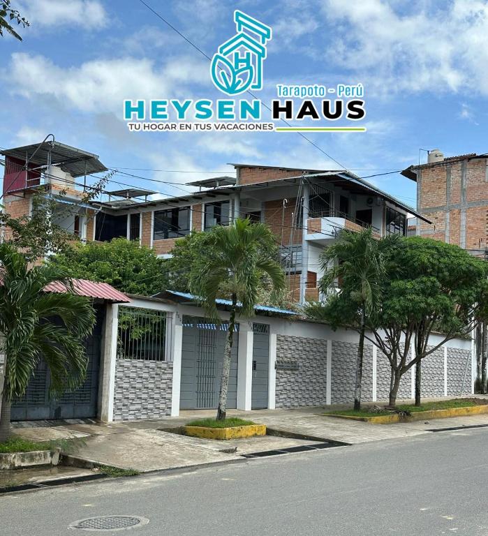 a building with a sign that reads hegew house at HEYSEN Haus in Tarapoto