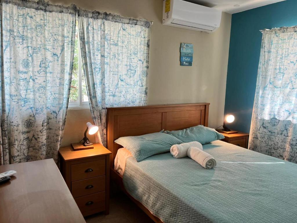 Postel nebo postele na pokoji v ubytování Hotel Bavaro