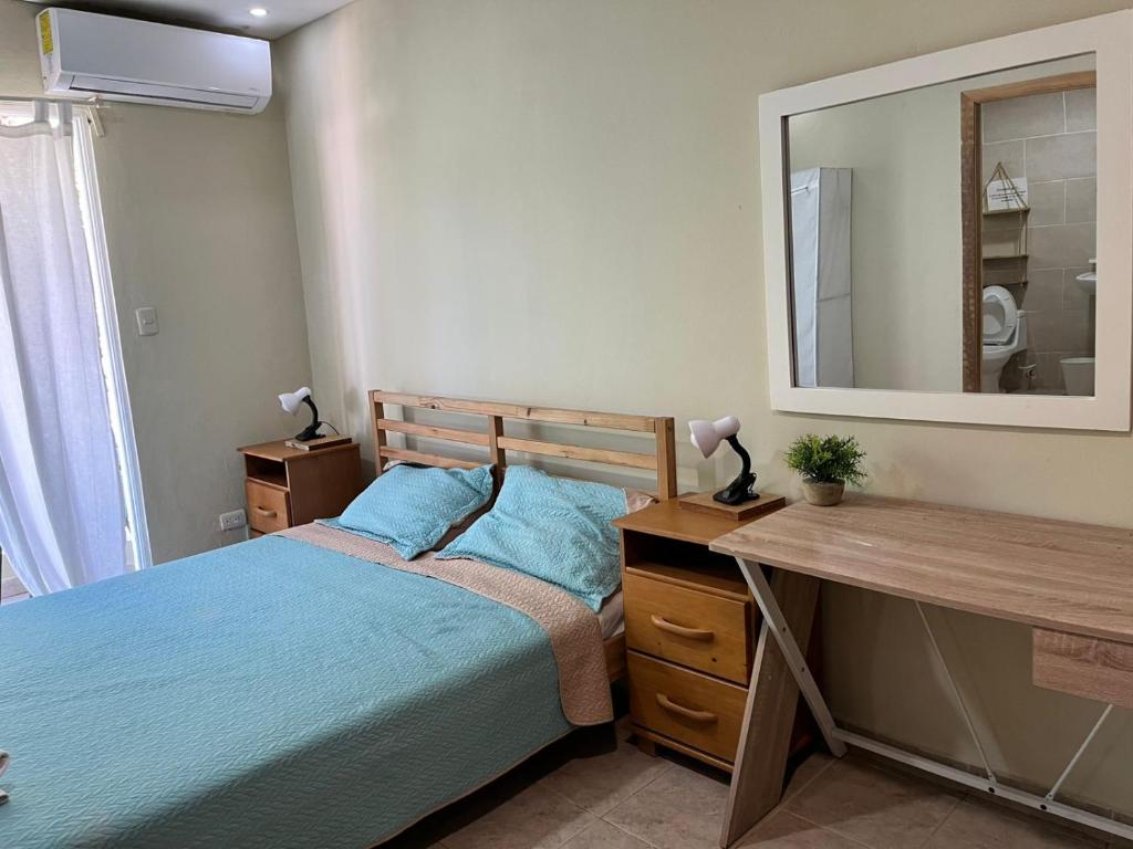 Postel nebo postele na pokoji v ubytování Hotel Bavaro