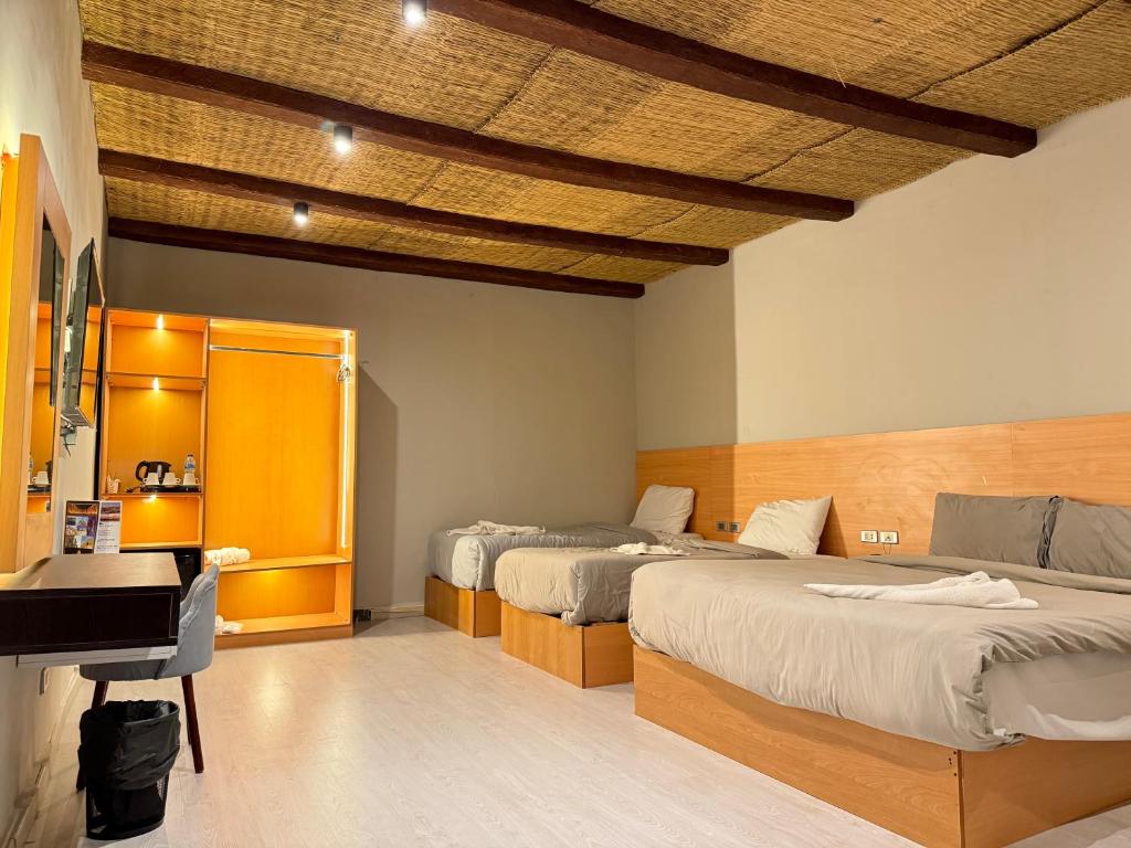 Postel nebo postele na pokoji v ubytování Pyramids NUT INN