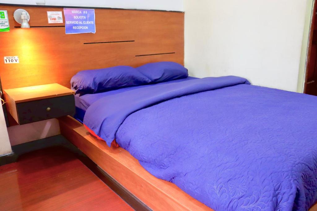 Postel nebo postele na pokoji v ubytování Hostal History