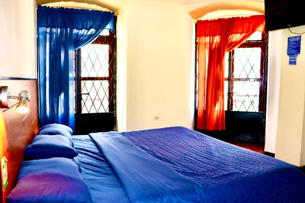 Postel nebo postele na pokoji v ubytování Hostal History