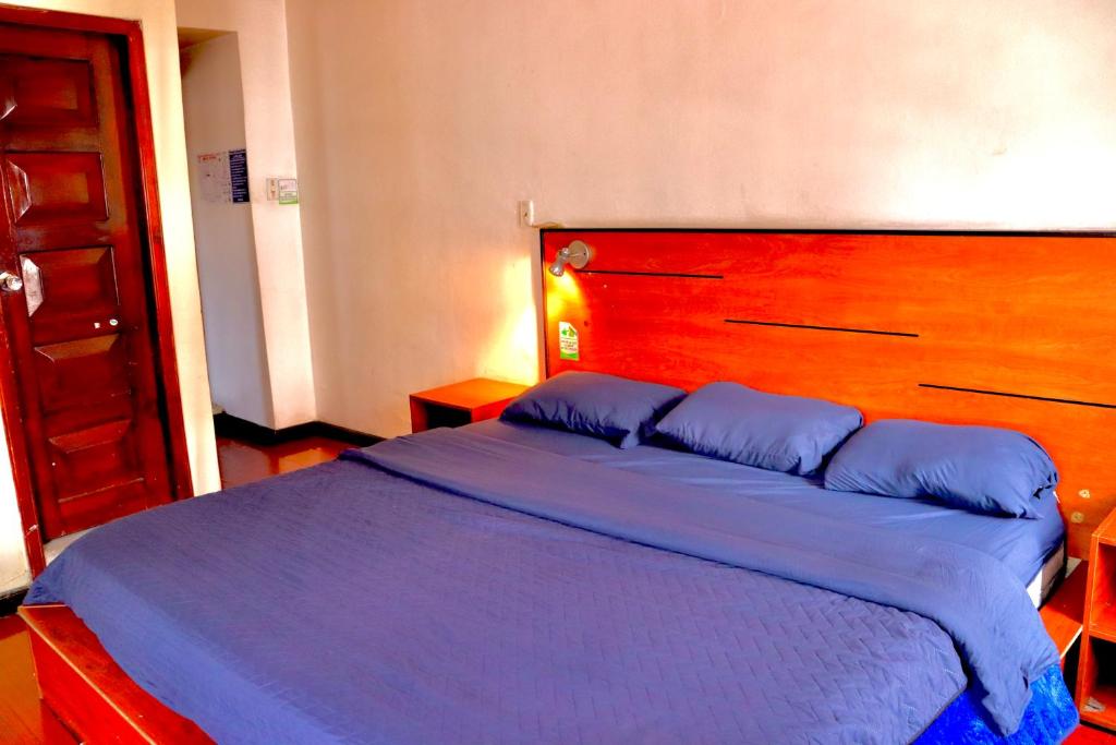 Postel nebo postele na pokoji v ubytování Hostal History