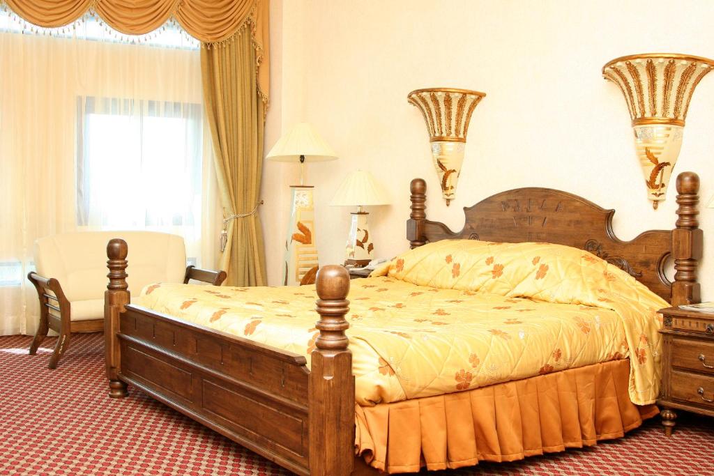 Imperial Resort Beach Hotel tesisinde bir odada yatak veya yataklar
