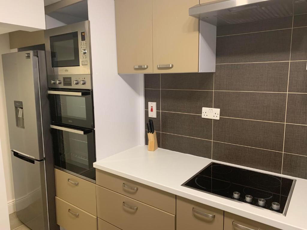 Kuchyň nebo kuchyňský kout v ubytování KCM Urban Retreats