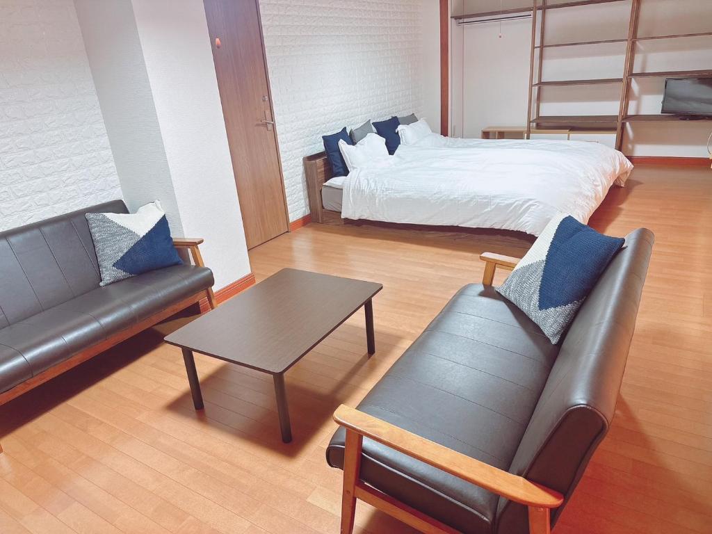 Postel nebo postele na pokoji v ubytování BLUE OCEAN 淡路屋 -Awajiya- Oceanfront BBQ PET OK
