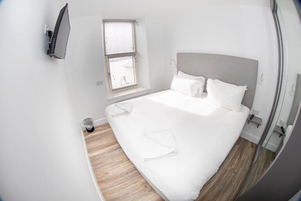 Postel nebo postele na pokoji v ubytování KCM Urban Retreats