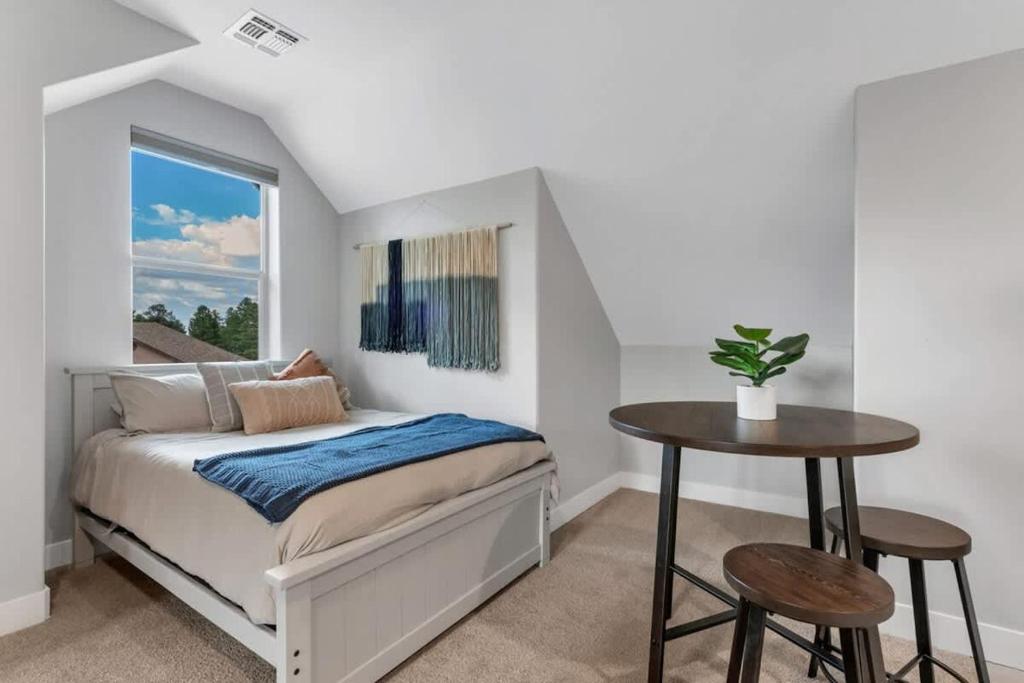 a bedroom with a bed and a table at Cozy Studio Space in Williams in Williams