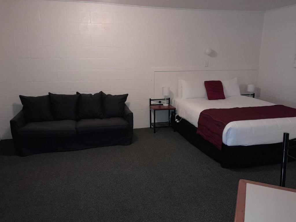 Postel nebo postele na pokoji v ubytování Murray Gardens Motel