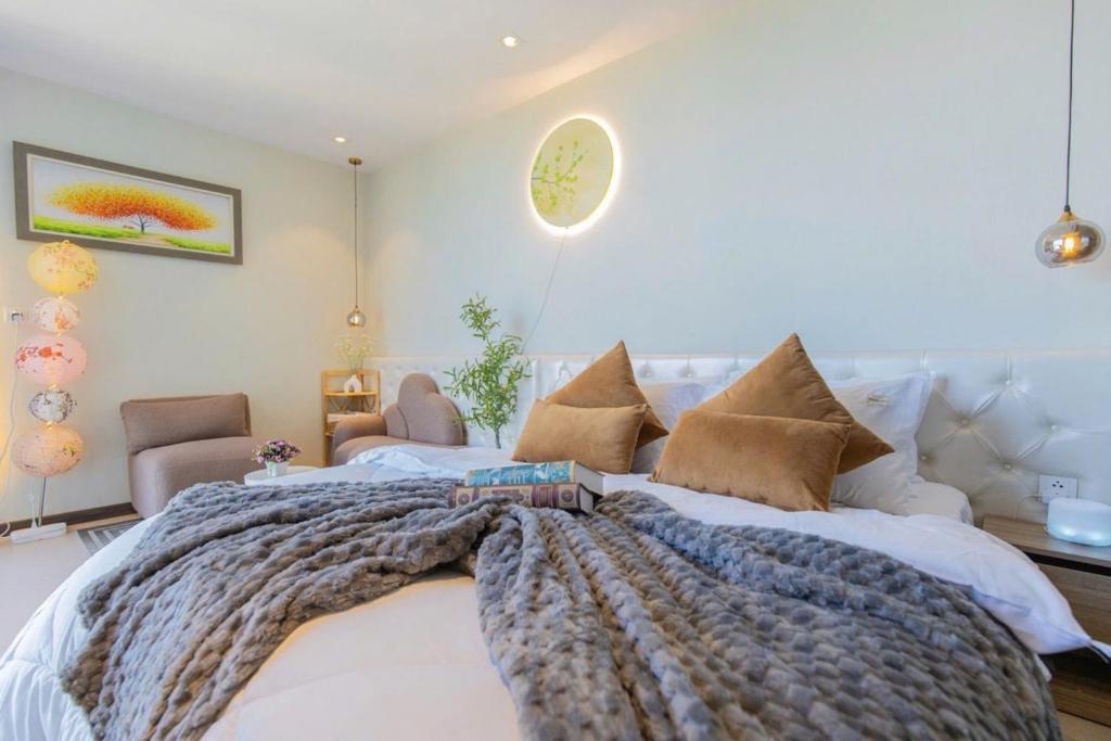 Postel nebo postele na pokoji v ubytování Condotel CSJ Luxury Vũng Tàu