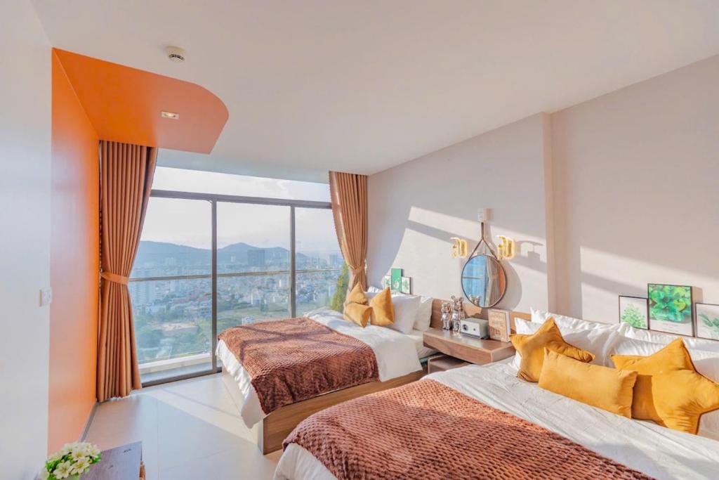 Postel nebo postele na pokoji v ubytování Condotel CSJ Luxury Vũng Tàu