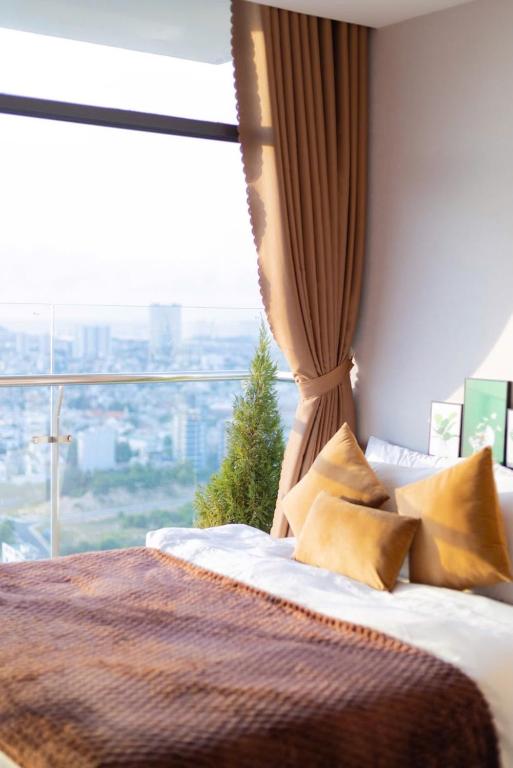 Postel nebo postele na pokoji v ubytování Condotel CSJ Luxury Vũng Tàu