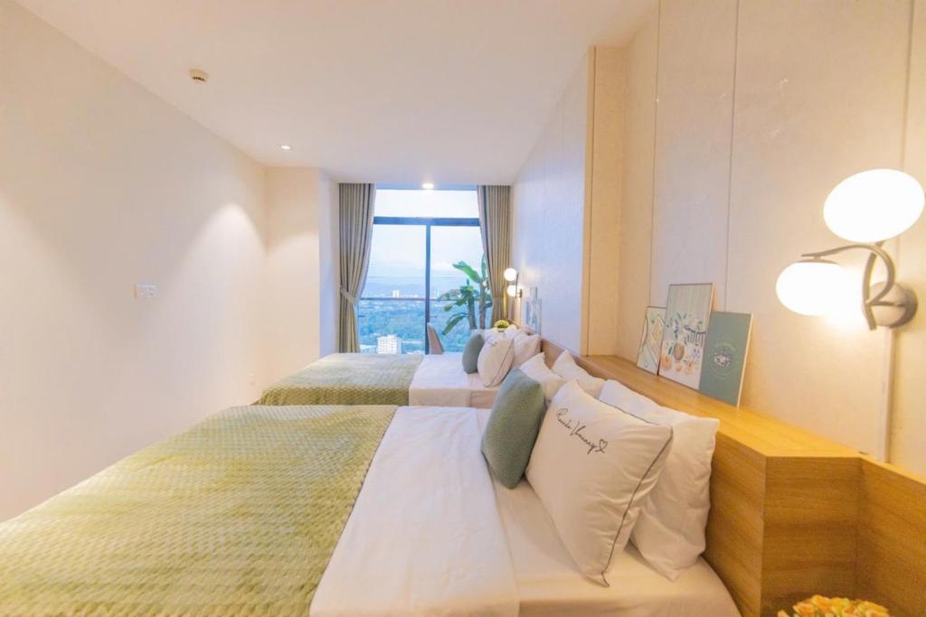 Postel nebo postele na pokoji v ubytování Condotel CSJ Luxury Vũng Tàu