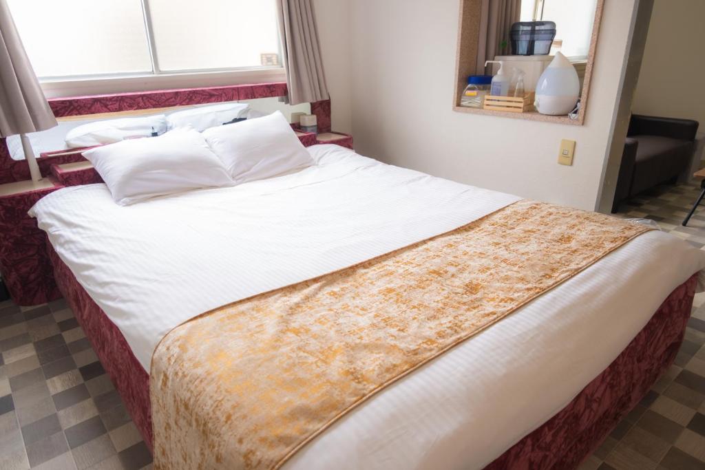 Postel nebo postele na pokoji v ubytování Hotel Lucia at Maebashi Akagi