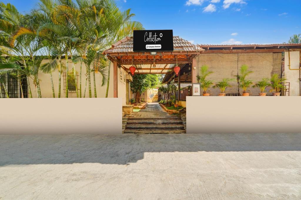 a entrance to a villa with a sign on it at Super Collection O Bannergatta Road Near Decathlon in Bengaluru