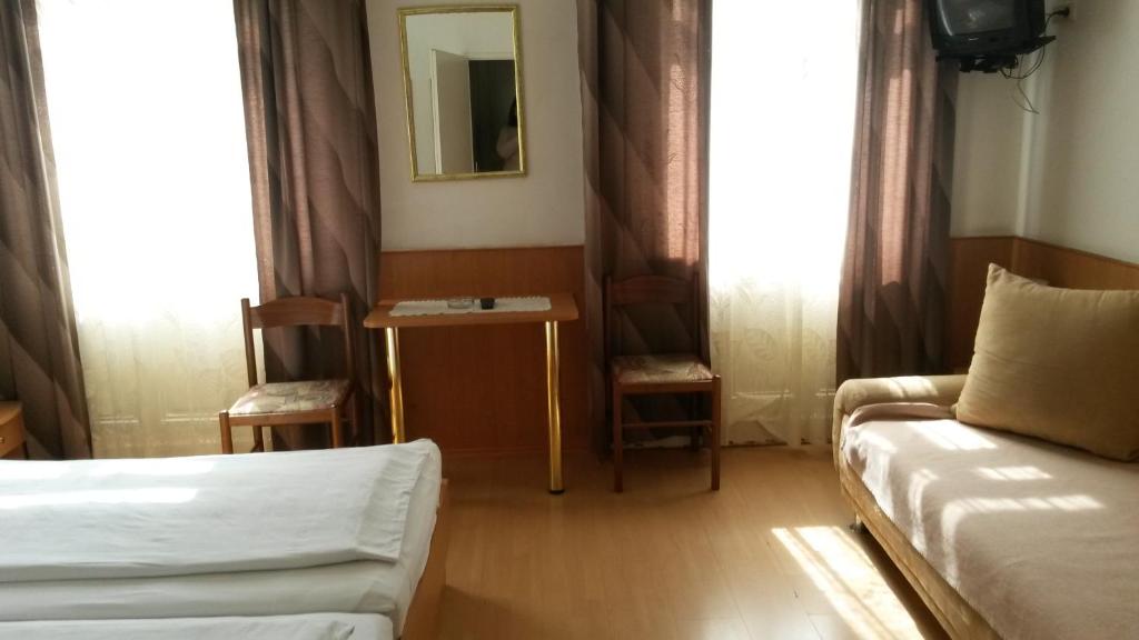 Posteľ alebo postele v izbe v ubytovaní Pension Ani