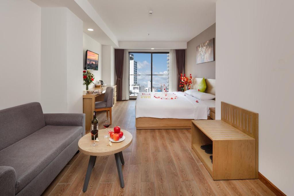 Giường trong phòng chung tại Ale Nha Trang Hotel