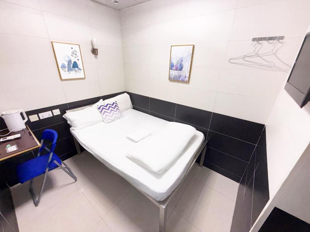 Letto o letti in una camera di Apple Hostel 蘋果賓館