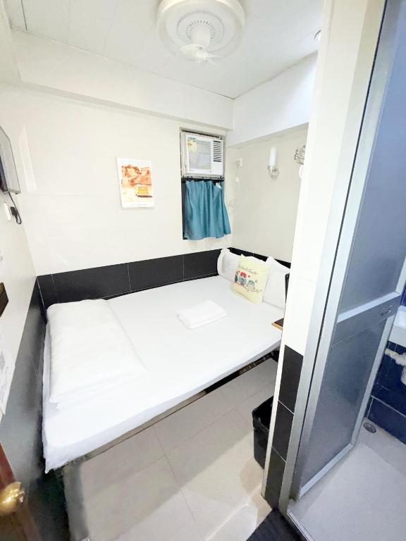 Letto o letti in una camera di Apple Hostel 蘋果賓館