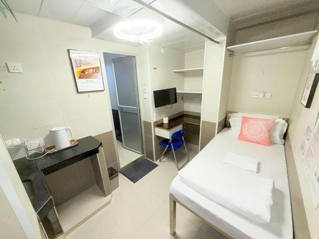 Letto o letti in una camera di Apple Hostel 蘋果賓館