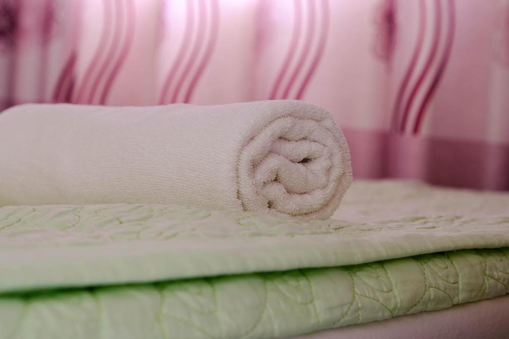 Postel nebo postele na pokoji v ubytování Lucky Hội an Hotel