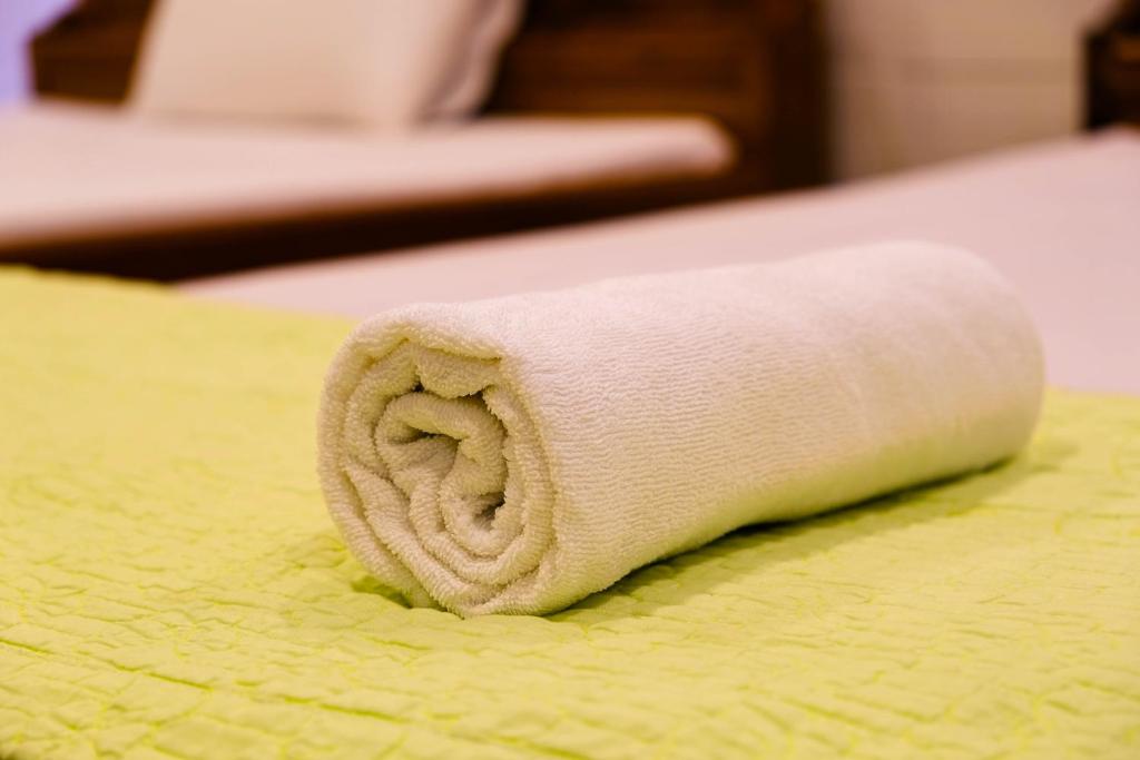 Postel nebo postele na pokoji v ubytování Lucky Hội an Hotel