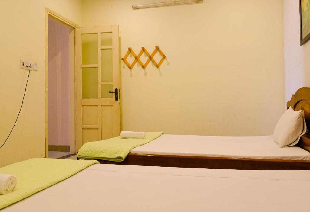 Postel nebo postele na pokoji v ubytování Lucky Hội an Hotel