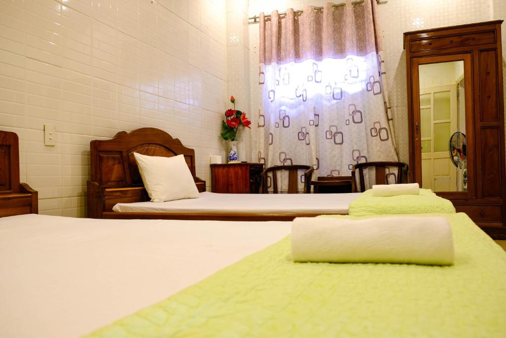 Postel nebo postele na pokoji v ubytování Lucky Hội an Hotel