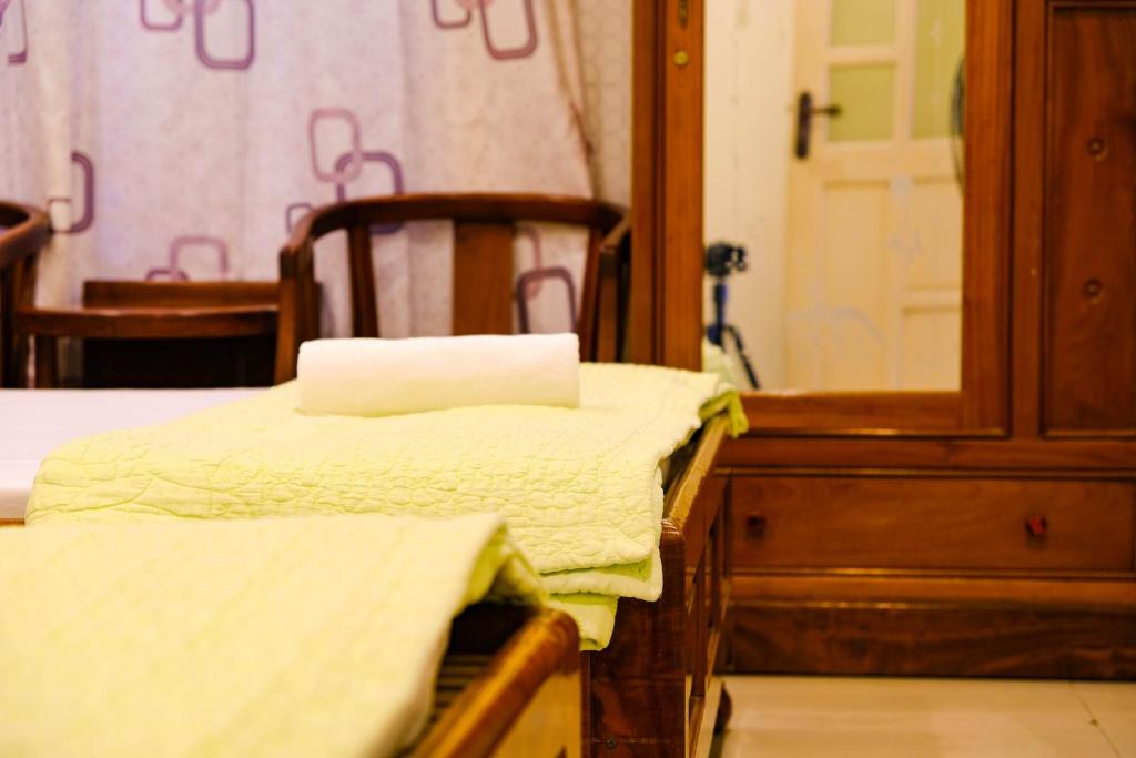 Postel nebo postele na pokoji v ubytování Lucky Hội an Hotel