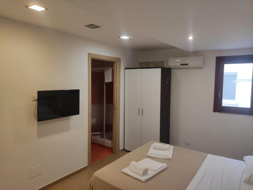 Telewizja i/lub zestaw kina domowego w obiekcie Cortile Antico