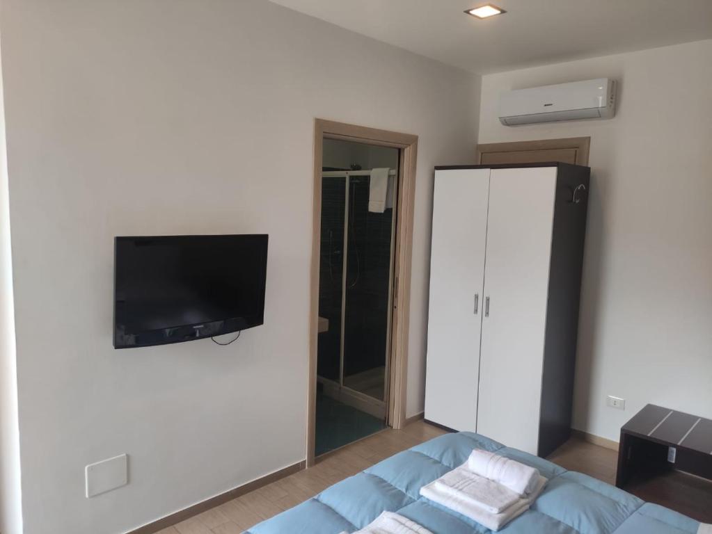 Telewizja i/lub zestaw kina domowego w obiekcie Cortile Antico