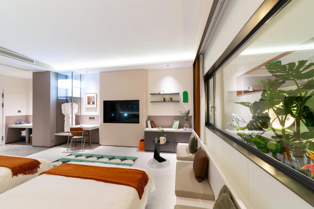 TV a/nebo společenská místnost v ubytování Vishan Keys Hotel 维尚潮宿