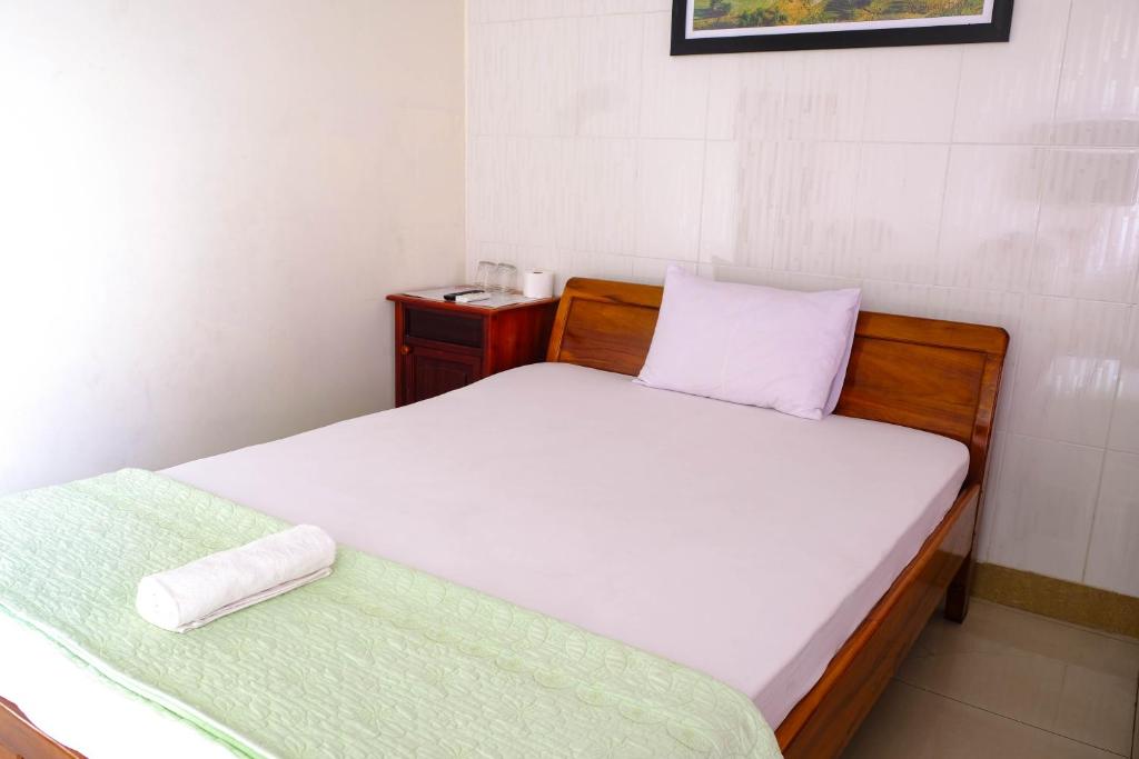 Postel nebo postele na pokoji v ubytování Lucky Hội an Hotel