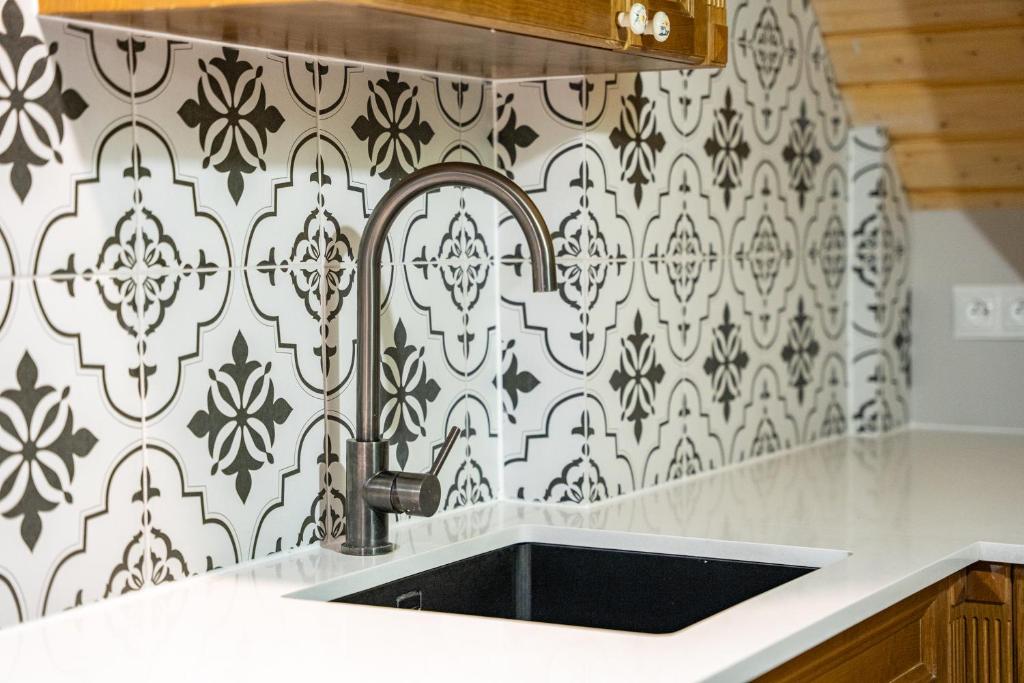 Kuchyňa alebo kuchynka v ubytovaní Apartamenty Galeria Trunków