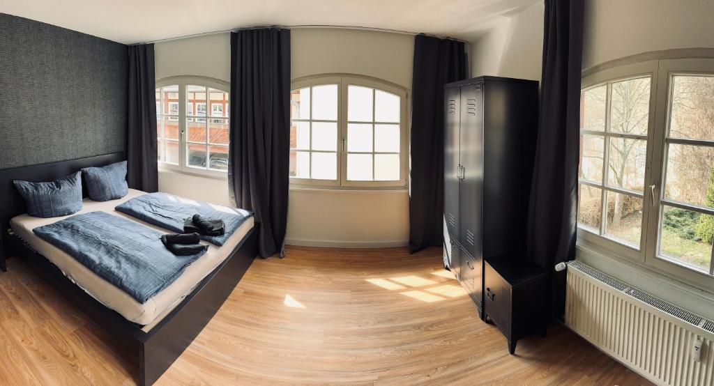 Postel nebo postele na pokoji v ubytování Steinplatz Suite