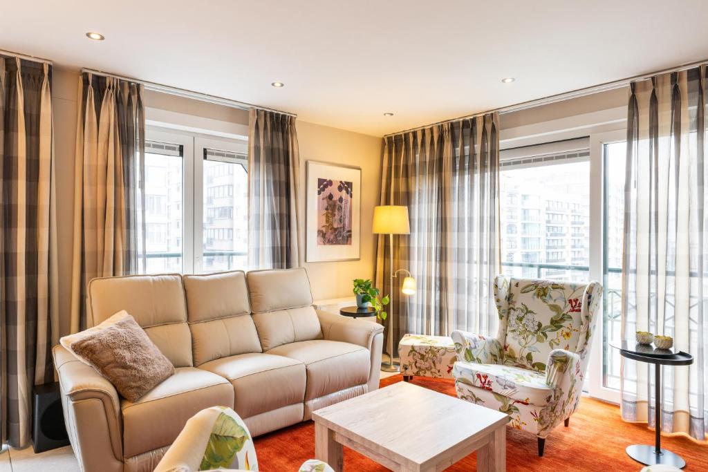 a living room with a couch and chairs at Dauphin 0401 in Wenduine