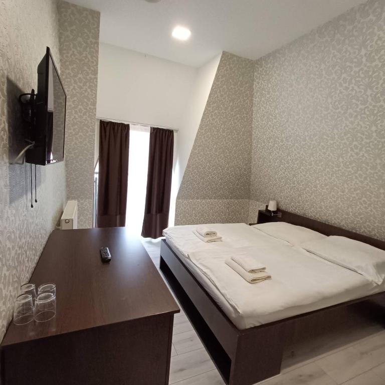 Postel nebo postele na pokoji v ubytování Wellness Hotel Bety