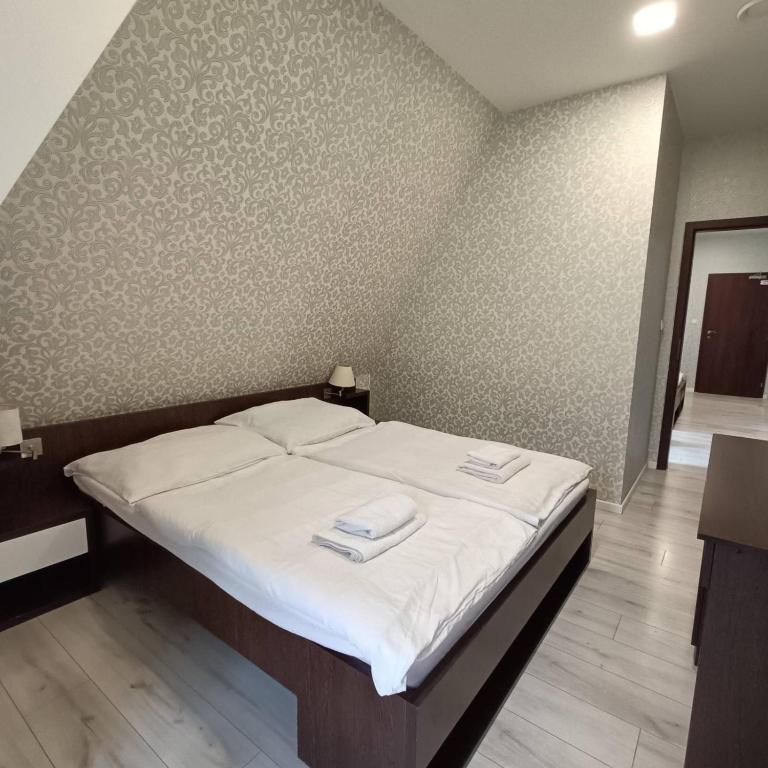 Postel nebo postele na pokoji v ubytování Wellness Hotel Bety