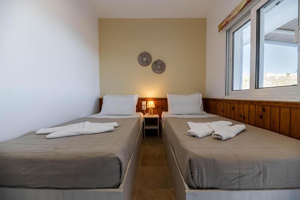 Łóżko lub łóżka w pokoju w obiekcie Aperanto Galazio Apartment
