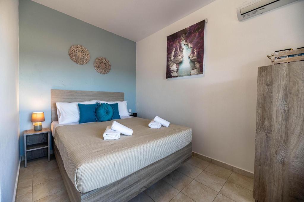 Łóżko lub łóżka w pokoju w obiekcie Aperanto Galazio Apartment