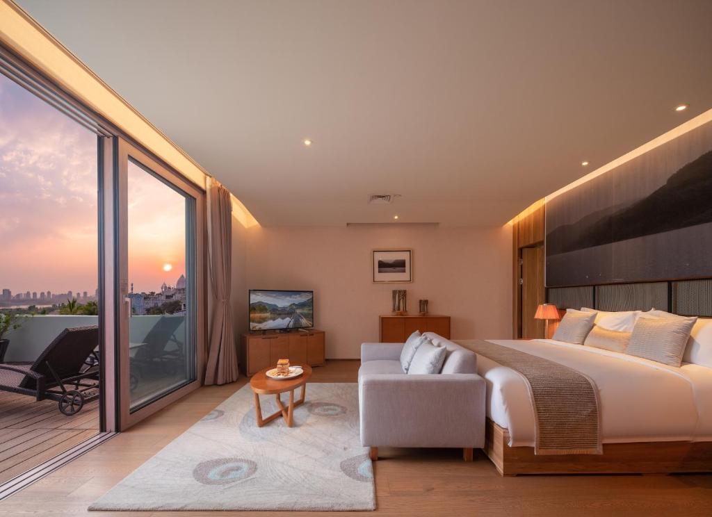 Postel nebo postele na pokoji v ubytování Yunjian Hotel