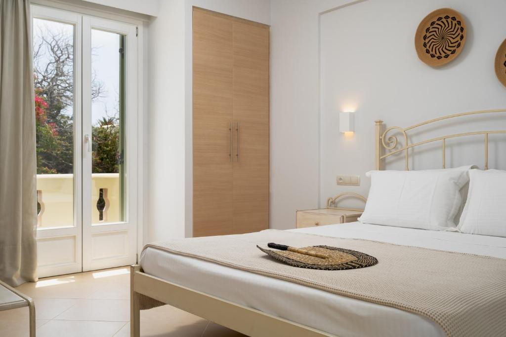 Кровать или кровати в номере Finikas Hotel
